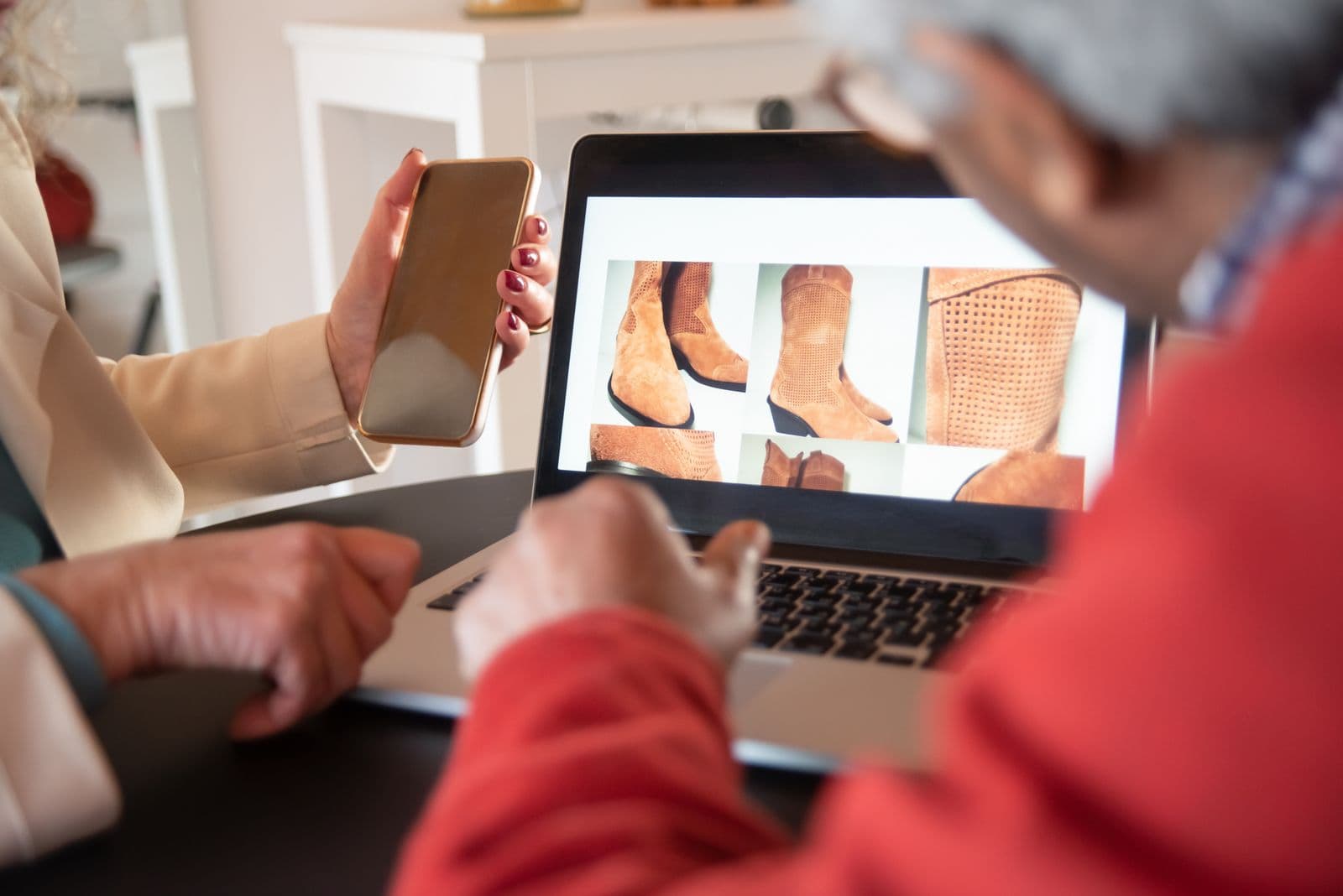 People browsing an online store on a laptop